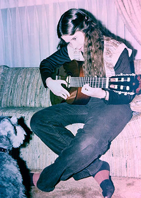 Krista Betcher playing guitar